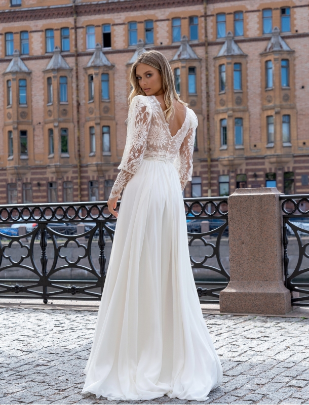 Wedding dress with a transparent bodice and voluminous sleeves