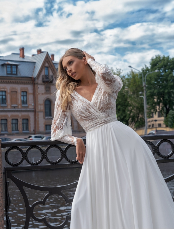 Wedding dress with a transparent bodice and voluminous sleeves